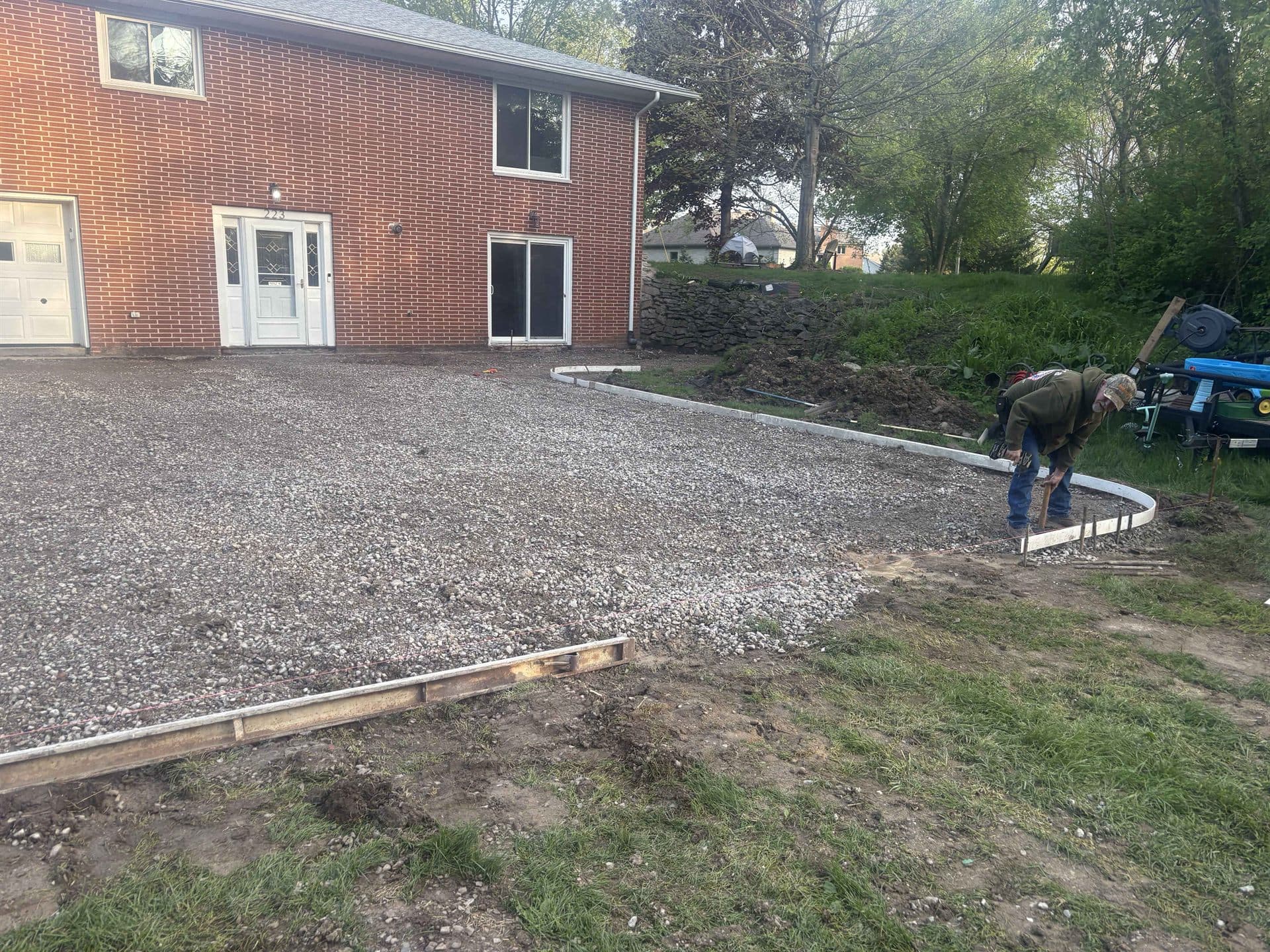 Ground work and gravel base prepped for a new driveway
