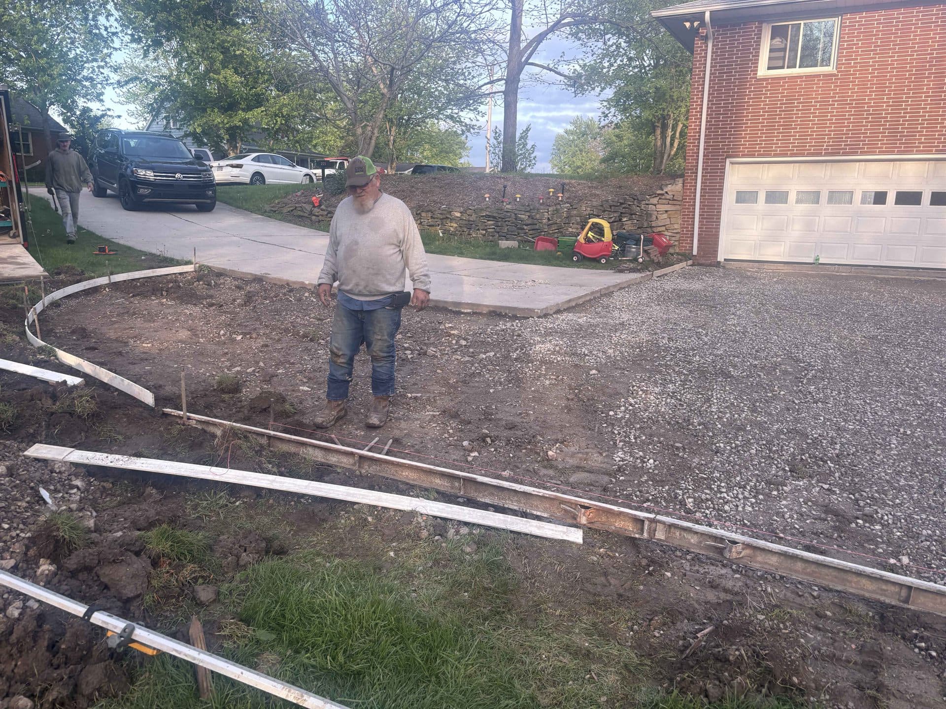 A graded driveway pad with forms set, ready for concrete